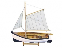 Wooden fishing boat with sails